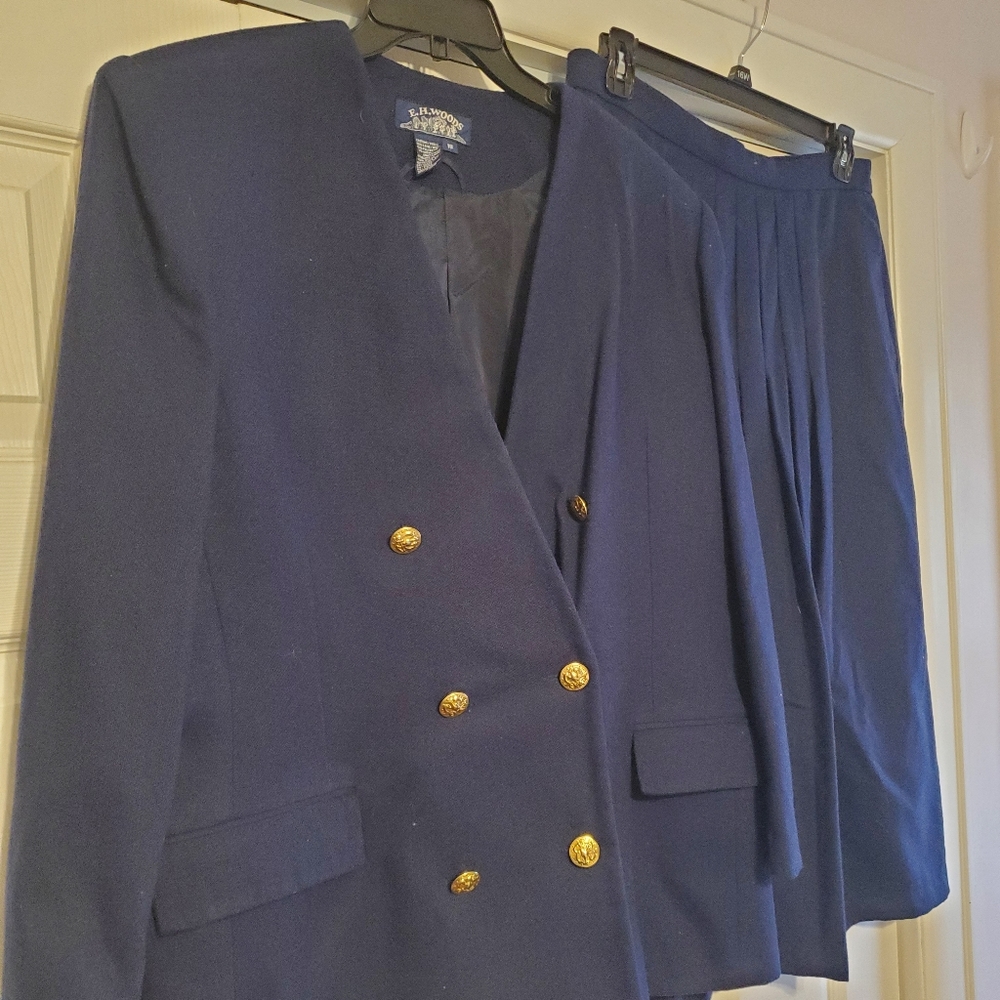 Navy blue wool dress jacket with matching pleated skirt. Size 18,